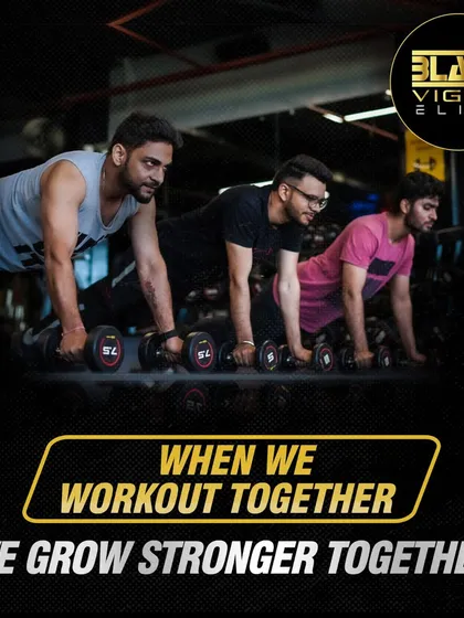 When we work out together, we grow stronger together. Our community thrives on mutual motivation, as seen here with members performing dumbbell push-ups in sync.
