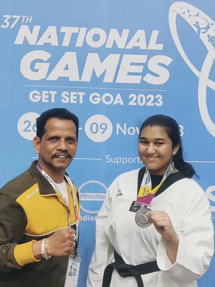 A proud moment coaching at the 37th National Games in Goa. Here I am with one of our state's top athletes after she won a silver medal. We prepare our students to compete and succeed at the highest levels of the sport.