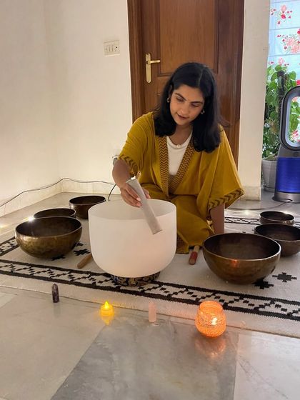 A guest instructor preparing her crystal and Tibetan singing bowls for a sound healing workshop. The pure tones of these instruments have a profound effect on the mind and body.