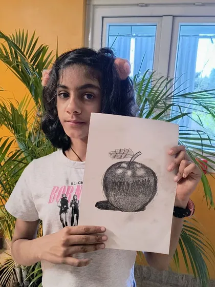 An excellent example of fine art sketching. This student's drawing of an apple shows a sophisticated use of cross-hatching for shading.
