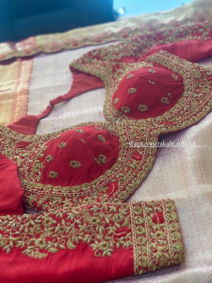 A red blouse with classic gold zardosi embroidery.