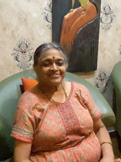 A close-up of our senior client, her smile reflecting the peaceful and satisfying experience she had with us.