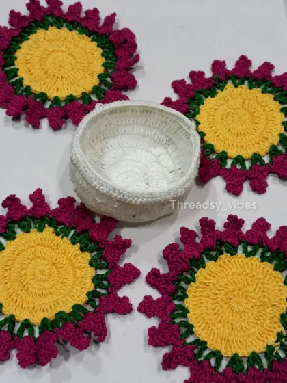 This is one of my favorite things to make! A complete set of four handmade floral crochet coasters with a little white basket to keep them all together. They are perfect for adding a pop of color to your coffee table.