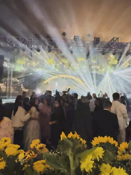 A wide shot showing the scale of the fort wedding. The combination of sunflowers, hanging lights, and powerful beams made for a breathtaking scene.