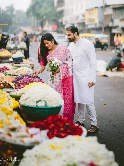 Finding beauty in the everyday. Chaitrali and Parth's pre-wedding shoot in Pune included a walk through a vibrant flower market, turning a simple setting into a backdrop for their love story.