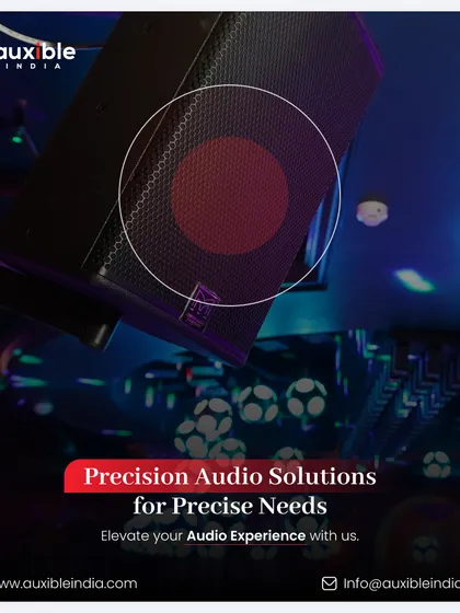 Precision audio solutions for precise needs. This image shows a powerful speaker angled down from the ceiling, positioned to cover a specific zone in a club, with unique football-shaped lighting fixtures visible below.