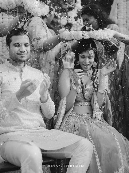 A black and white shot of the Haldi ceremony, focusing on the joy and emotion of the moment. Sometimes, monochrome can make a moment even more powerful.