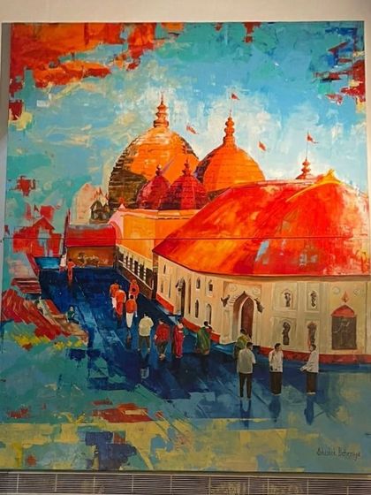 The Kamakhya Temple painting on display. The vibrant oranges and blues make it a visually stunning piece that draws you in.