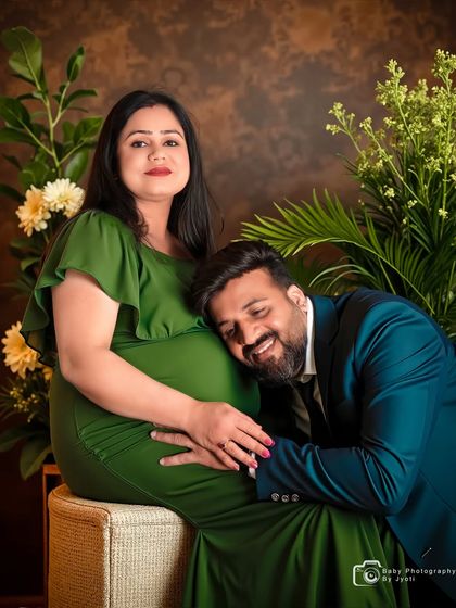 A sweet and loving pose with the dad-to-be listening to the baby bump. This classic couple's maternity pose is always a favorite for capturing the connection before the baby arrives.