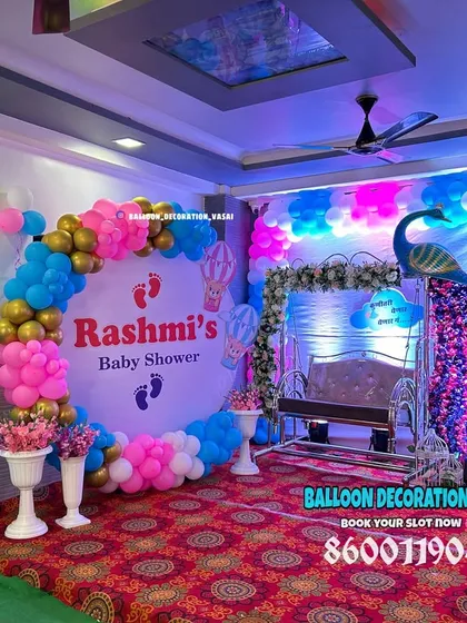 This baby shower decoration combines two popular themes: a sequin peacock and cute teddy bears on the moon. The mix of pink and blue balloons makes it a great choice for a gender-neutral or reveal party.