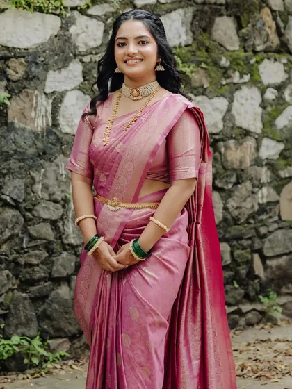 A different engagement look in a pink silk saree, showcasing my ability to create varied looks for the same client.