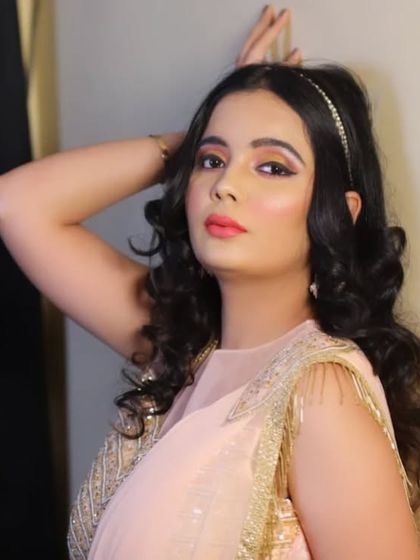 This peach-colored indo-western lehenga is a stylish and comfortable rental option for wedding guests.