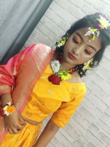 A beautiful portrait of the finished Haldi look. Our students practice on real models to understand different face shapes and skin tones, ensuring they are ready for professional client work.