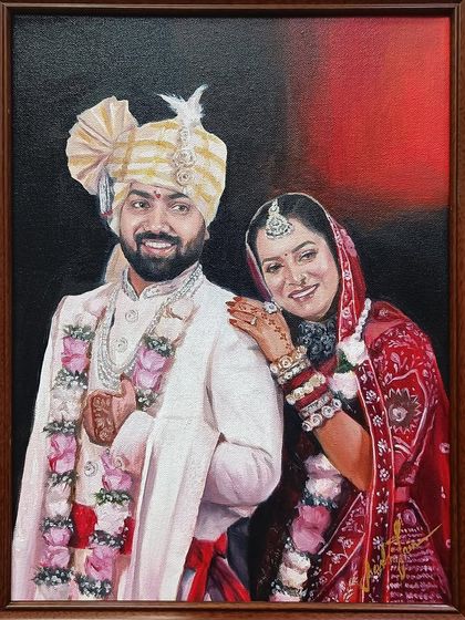 A classic wedding portrait, framed and ready to hang. The contrast between the couple's beautiful attire and the dark, moody background makes their figures pop.