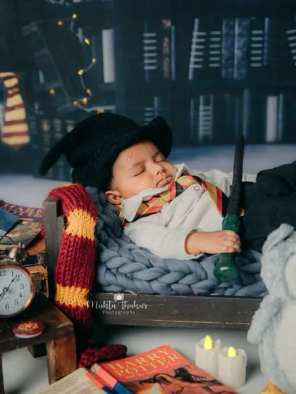 Another magical shot of our baby Harry, sleeping peacefully with his owl friend Hedwig by his side.
