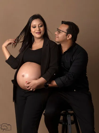 A playful and confident pose. The modern styling and their happy expressions make this a unique and memorable shot.