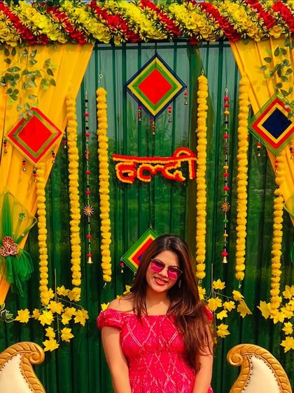 Posing at the Haldi photo booth before the ceremony starts. The decor was on point.