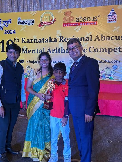 This student and his family are all smiles after he received his trophy. These moments of recognition motivate our students to aim even higher.