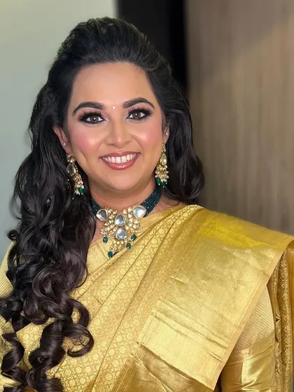 A beautiful, confident smile from the engagement bride. The soft curls and glowing makeup complete her elegant look.