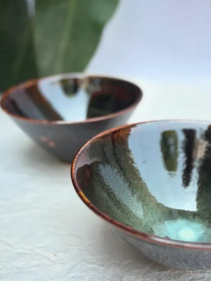 A pair of our signature ramen bowls, each with its own unique pattern. This is the beauty of handmade ceramics; no two are ever exactly alike.