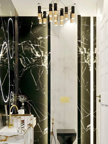 A powder room concept with black marble walls, a fluted white accent panel, and organically shaped backlit mirrors. The design is modern, artistic, and luxurious.