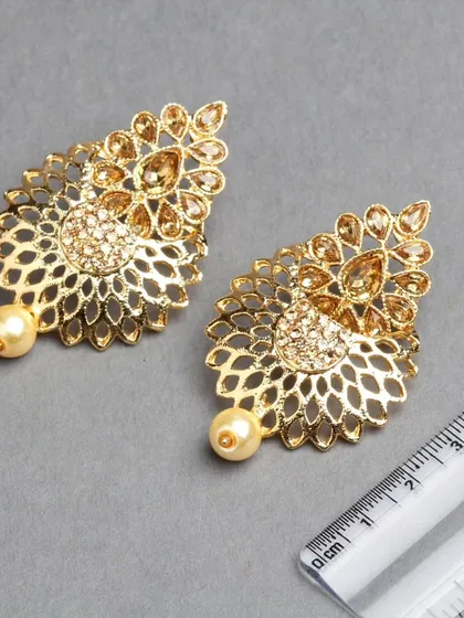 Another view of the golden filigree earrings, showing the beautiful craftsmanship.