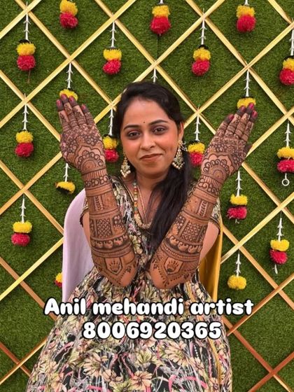 A beautiful client proudly showing her full-arm mehendi. Her smile says it all. I work to make sure every bride feels this happy with her design.