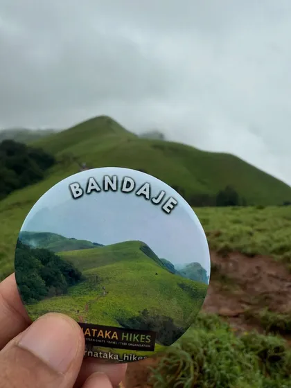 Our Bandaje trek badge held up against the actual landscape it depicts. A perfect match.