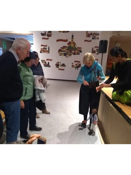 Our puppeteer showing an international audience how a marionette works. We love sharing the mechanics behind the art form.