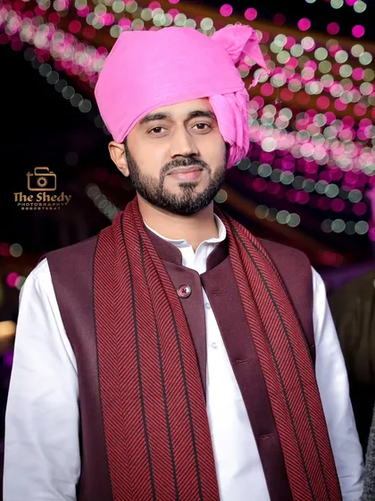 A portrait of a guest looking sharp in a pink turban and traditional Indian attire. We capture the style of your friends and family too.