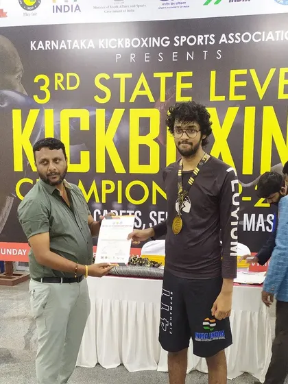 One of our students receiving his certificate and medal at the WAKO Karnataka championship. This is what dedication and consistent training can achieve.