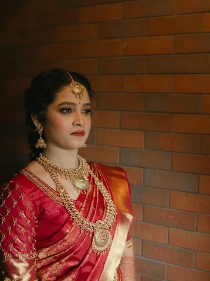 A pensive and beautiful portrait. The makeup enhances her features, creating a look that is both traditional and deeply personal.