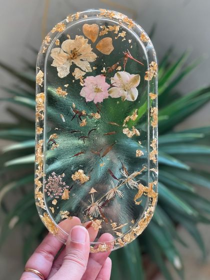 A delicate and beautiful resin tray made with pressed flowers and gold leaf. This is a popular project in our resin art workshops.
