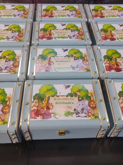 A full set of my popular jungle-themed trunk boxes, ready for a birthday party. The custom-printed lids create a big impact when displayed together at the event.
