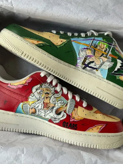 The full set of Luffy vs Zoro custom Nike Air Force 1s displayed in their box, ready to be shipped.