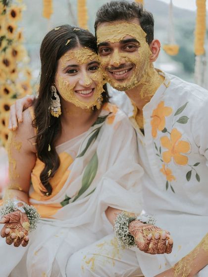 A happy, turmeric-covered selfie moment. This shot captures the fun and modern take on a traditional ceremony.