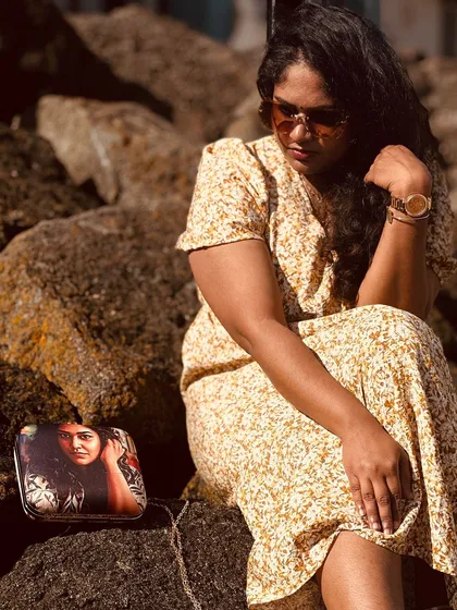 A quiet moment with a cherished memory. This image beautifully captures a customer with her personalized photo clutch. It’s more than an accessory; it’s a story you carry with you.