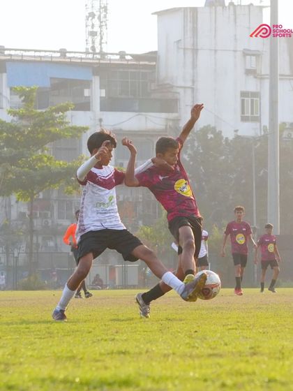 A mid-air challenge for the ball, showing the commitment and bravery of our players.