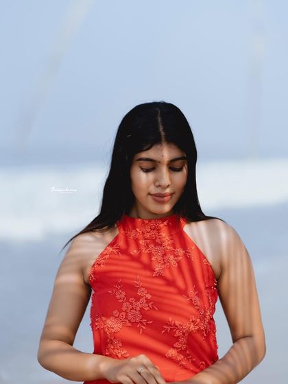 A serene portrait with soft sunlight filtering through leaves, creating a gentle pattern on the model's face. This technique adds a touch of artistry to a simple portrait.