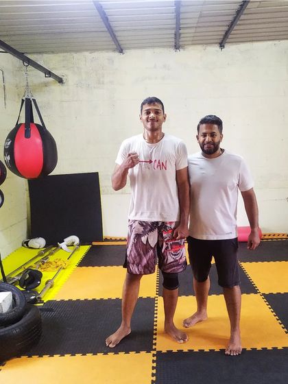 Posing with a student after a Sunday kickboxing training session at Sai MMA Academy. We offer weekend batches for both kickboxing and BJJ.