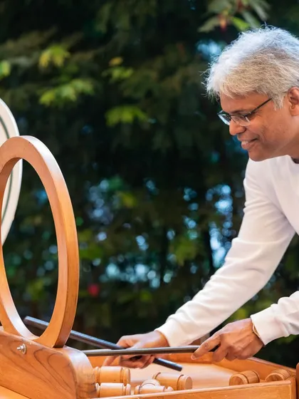 Guests enjoying a unique wooden carnival game. We can arrange for a variety of interactive entertainment options to keep guests of all ages engaged and having fun.