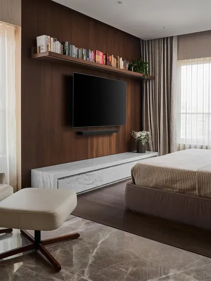 The master bedroom in Project Acropolis is a tranquil oasis. I designed this floating Carrara marble TV console to house all electronics, creating a clean, bold statement against the warm walnut wood paneling.