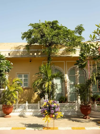 The courtyard of Chomu Palace, set up for the Haldi. The venue's natural beauty is enhanced by our carefully placed floral arrangements.