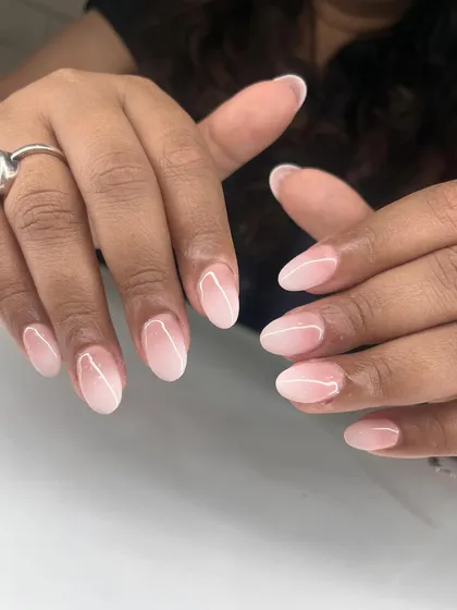 You can never go wrong with a classic ombré. I achieve this soft, blended look by carefully fading a milky white into a natural pink base for an effortlessly elegant manicure.