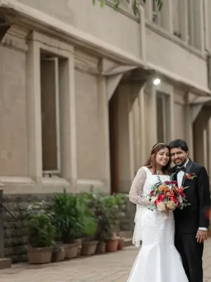A classic portrait of a couple after their church wedding. This image captures the elegance and grace of the day, with the beautiful architecture providing a timeless backdrop.