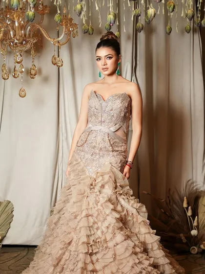 Our signature glam. This look features a dramatic winged liner, a high bun, and flawless skin, creating a diva-like effect perfect for a grand reception.