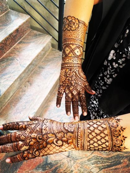 Another angle of this beautiful Indian henna design, showing the intricate work on the back of the hands and arms.
