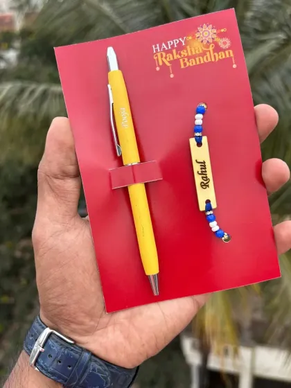 The turbo pen and rakhi combo shown in a cheerful yellow color.