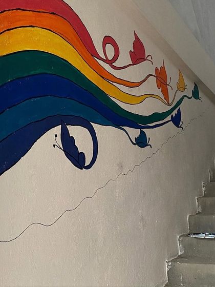 We had so much fun beautifying the walls of Ikshana Patashala, a preschool. We painted several murals, including a welcome wall with kids and flowers, and a large "tree of knowledge" doodle, to create a playful and inspiring environment.