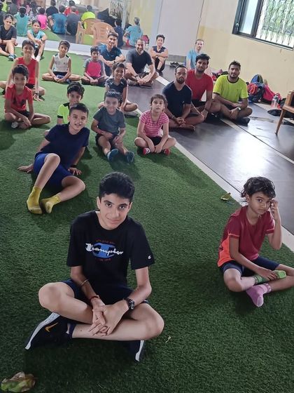 The team unwinding together after a post-workout session. Building a strong community is as important as building strong athletes.